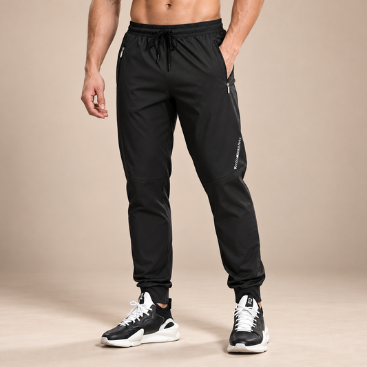 Zwarte joggingbroek heren loose fit met elastische taille en ritszakken vooraan