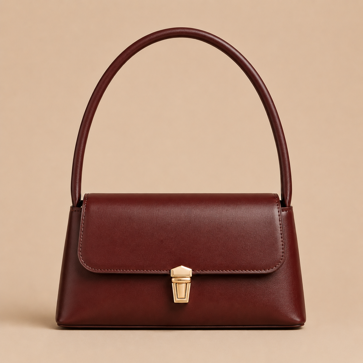 Bordeauxrode dames handtas met flap handvat en gouden sluiting