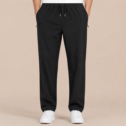 Joggingbroek Heren Lichtgewicht - Casual Trainingsbroek met Ritszakken en Trekkoord in zwart – productgericht vooraanzicht op beige studioachtergrond