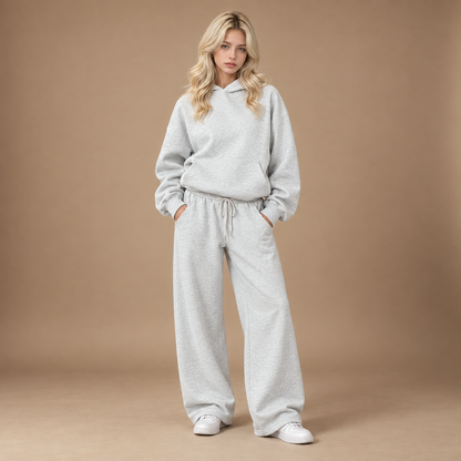 Trainingspak dames lichtgrijs met hoodie en wide leg broek volledige outfit studio