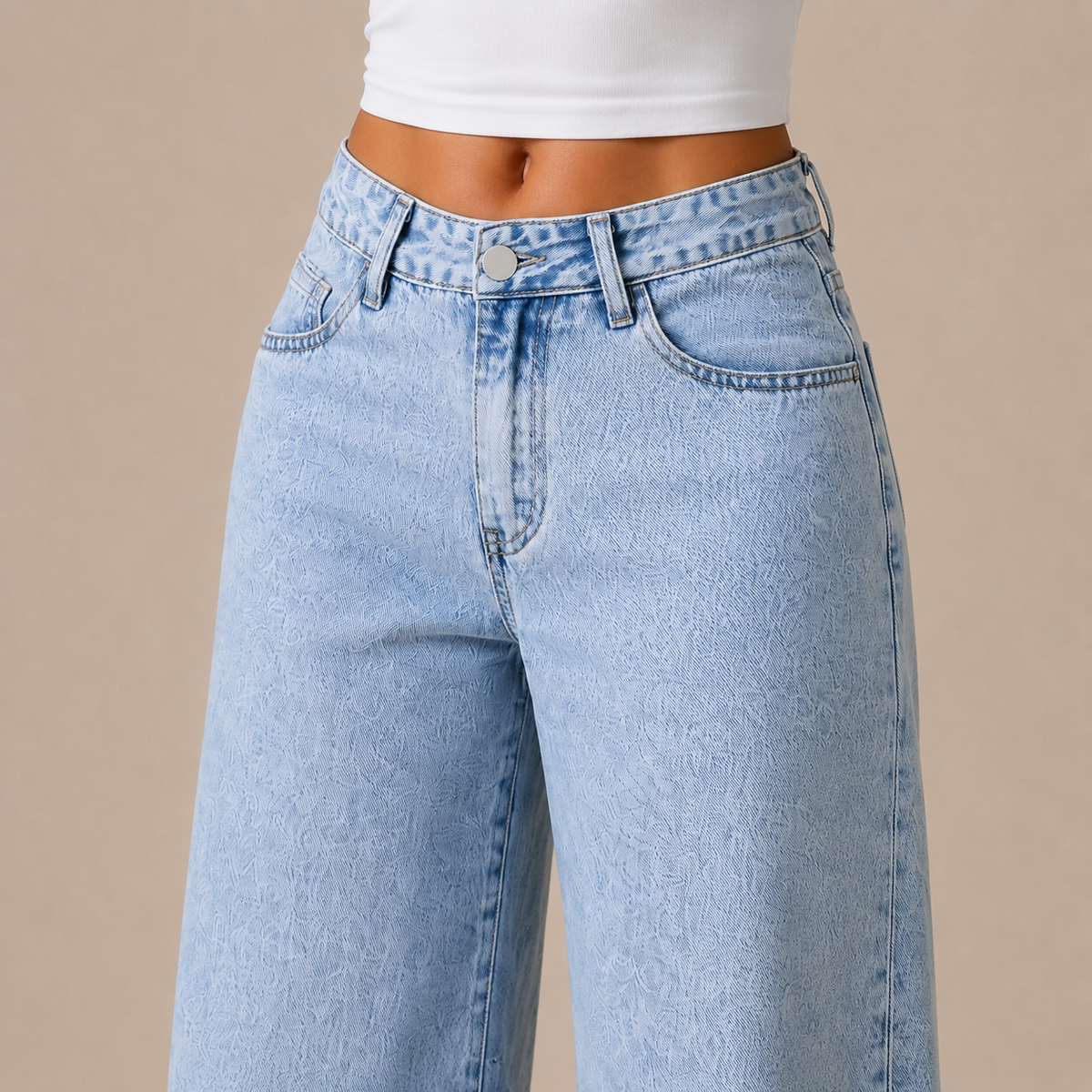Detail van hoge taille, zakken en acid-wash denim van wide-leg jeans dames